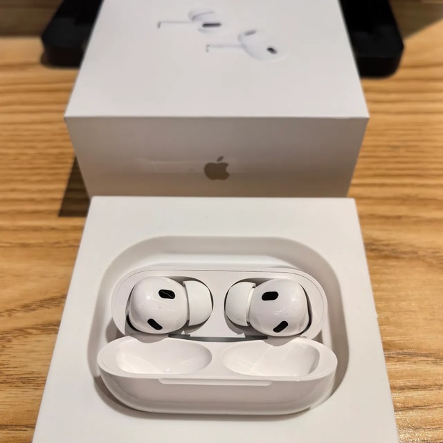 AirPods Pro 2 open charging case in retail presentation tray