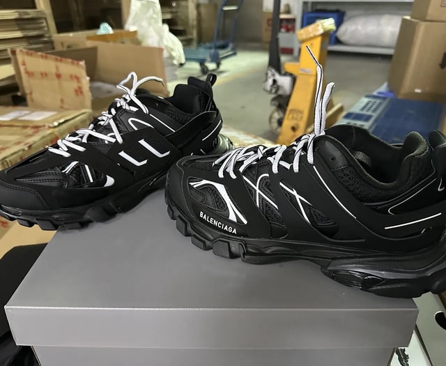 Balenciaga black runner sneakers with white laces and logo details